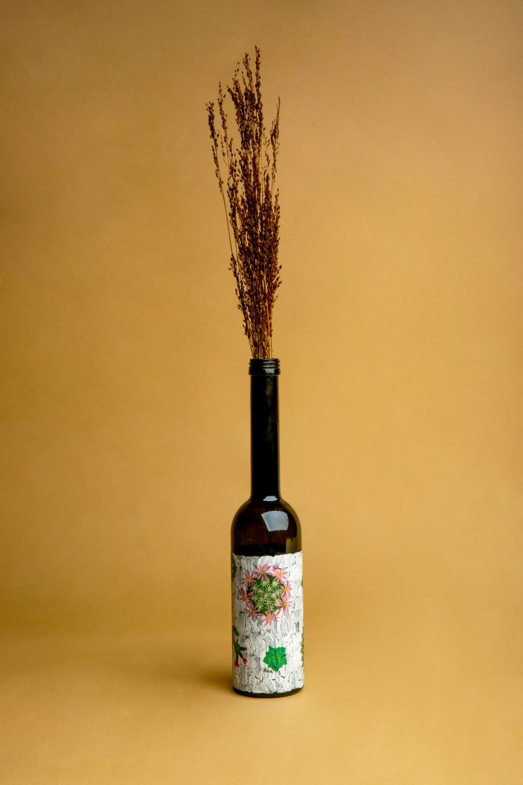 Botella de vidrio decorado